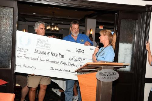 Solutions of North Texas awarded a check for $10,250! 